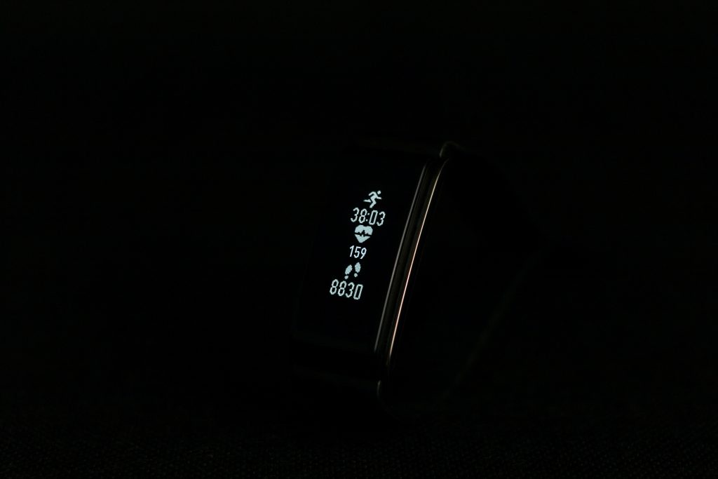 close-up photo of black fitness band powered on