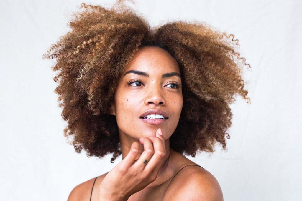 woman with brown curly hair